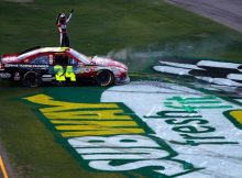Jeff Gordon gets out of his car to salute the fans after winning the SUBWAY Fresh Fit 500 at Phoenix International Raceway, ending a 66-race winless streak. Credit: Todd Warshaw/Getty Images for NASCAR